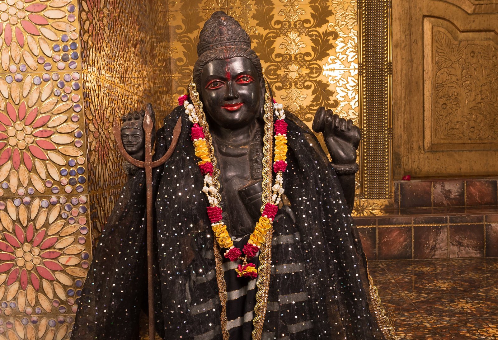 Batuk Bhairav, also known as Bala Bhairav, is a youthful manifestation of Lord Bhairav, who is an incarnation of Lord Shiva. In Hindu tradition, Lord Bhairav is revered as the fierce protector and guardian of divine laws. While Lord Bhairav is often depicted in a formidable and fierce form, Batuk Bhairav represents his gentle, childlike aspect. This youthful form is particularly significant as it symbolizes innocence, vitality, and the protective qualities that come without the overwhelming force typically associated with Lord Bhairav. Batuk Bhairav Poojan, or the worship of Batuk Bhairav, is a powerful ritual that invokes the blessings of this child form of Bhairav. Devotees seek his protection, guidance, and the removal of obstacles from their lives through this pooja.